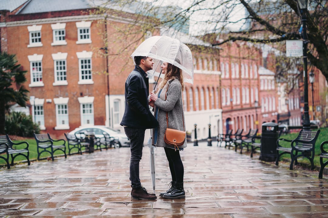 A couple sharing an umbrella on a rainy day