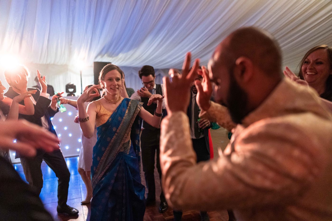 Guests dancing at a wedding reception